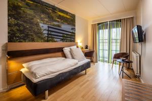 Voodi või voodid majutusasutuse Hotel Birksø toas
