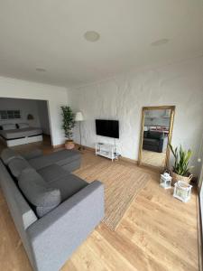 a living room with a couch and a mirror at Sunset bungalow Oceanfront Relax in Los Realejos