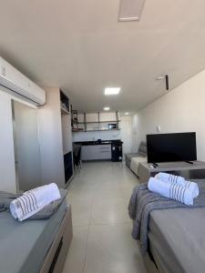 En eller flere senge i et værelse på Voll 29 Smart Flat Manaíra + 16 billeder