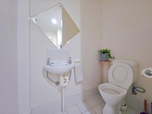 a bathroom with a sink and a toilet and a mirror at Eden - Love of Wright 伊甸园 - 怀特之爱 in Adelaide +30 photos