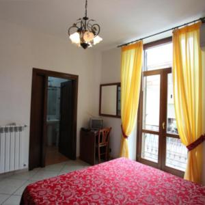 Postel nebo postele na pokoji v ubytování Hotel Savoia