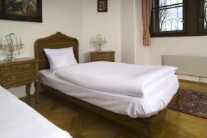Postel nebo postele na pokoji v ubytování Hotel Štekl
