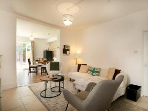 a living room with a couch and a table at Pass the Keys Bright & Cosy Home with Garden Free Parking in Nottingham