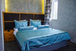 Postel nebo postele na pokoji v ubytování Royal Qala Hotel