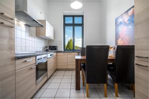 Kuchyň nebo kuchyňský kout v ubytování InselLiebe mit Seeterrasse