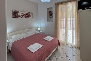 Ένα ή περισσότερα κρεβάτια σε δωμάτιο στο Aspasia Studios +31 φωτογραφίες