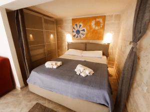 Letto o letti in una camera di Le Bianche Suites Ostuni