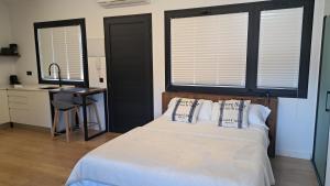 Letto o letti in una camera di Calma Suites Tejeda