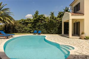 The swimming pool at or close to Villa Helios