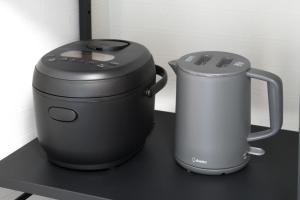 two appliances sitting on top of a black table at LudiCent717 - Vacation STAY 08156v in Toyohira