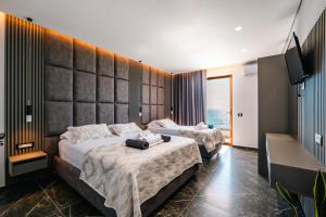 Postel nebo postele na pokoji v ubytování Blue Bay Hotel