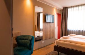 Postel nebo postele na pokoji v ubytování Hotel Sportforum