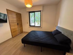 Ένα ή περισσότερα κρεβάτια σε δωμάτιο στο Maison proche des plages +1 φωτογραφίες