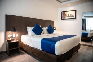 Alisa Hotel North Ridge客房内的一张或多张床位