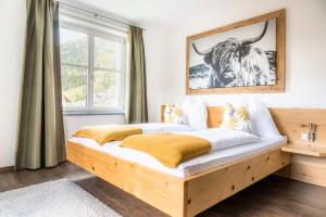 Postel nebo postele na pokoji v ubytování Höllhof Dachstein West