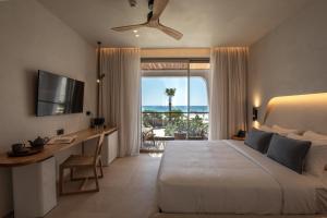 Cama ou camas em um quarto em Nuca Mykonos