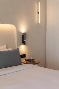 Cama ou camas em um quarto em Nuca Mykonos