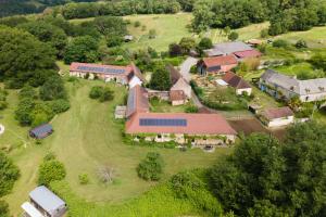 an aerial view of a house with a yard at Maison De Vacances Chêne in Auriac-du-Périgord