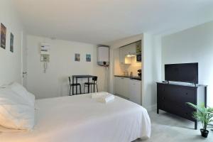 En eller flere senge i et værelse på Le Pithou - votre pied à terre équipé en ville 5