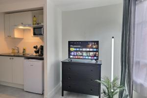 Køkken eller tekøkken på Le Pithou - votre pied à terre équipé en ville 5