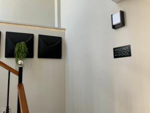 a wall with a sign that reads bismillah food at Hotel Puerta del Mar - Adults Recommended in Nerja