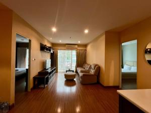 a large living room with a couch and a bed at Luxury Villa Patong in Patong Beach