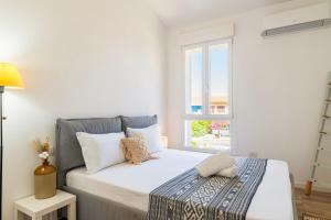 Postel nebo postele na pokoji v ubytování Sardinian Pearl - Poetto Beach Villa, South Sardinia