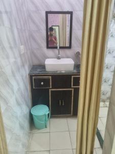 a bathroom with a sink and a mirror at Hotel Sandeep palace in Jāmb