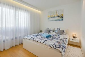 Ένα ή περισσότερα κρεβάτια σε δωμάτιο στο Aurelius Luxury Apartment