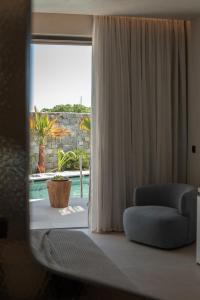 Cama ou camas em um quarto em Nuca Mykonos