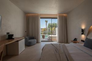 Cama ou camas em um quarto em Nuca Mykonos