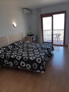 Postel nebo postele na pokoji v ubytování Hotel Condestable
