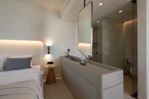 Cama ou camas em um quarto em Nuca Mykonos