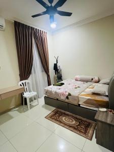 Ένα ή περισσότερα κρεβάτια σε δωμάτιο στο Vista Sentul Residence