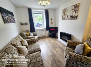 Ruang duduk di Moon Cottage By Prestige Properties SA
