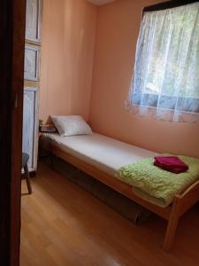 Postel nebo postele na pokoji v ubytování Kucica za odmor Lena I Matija