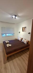 Postel nebo postele na pokoji v ubytování Apartman Marija