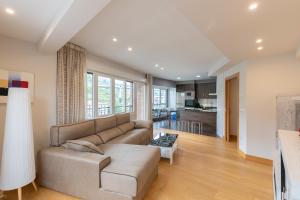 a living room with a couch and a table at Zerkausi - baskeyrentals in Tolosa