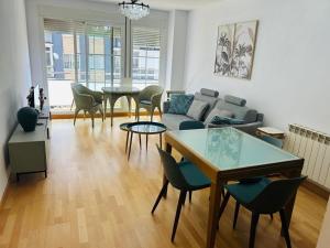 a living room with a couch and a table at Miguel Servet con GARAJE INCLUIDO in Zaragoza +9 photos