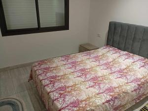 a bedroom with a bed and a window at Tunisia la Goulette in Tunis