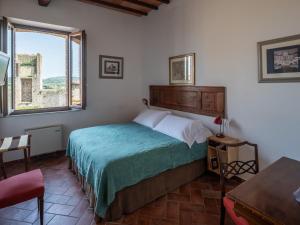 Posteľ alebo postele v izbe v ubytovaní Rooms and Wine al Castello