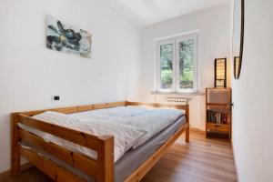 a bedroom with a bed in a room at Casa Edda in Brenzone sul Garda