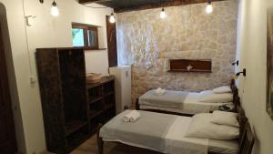 Ein Bett oder Betten in einem Zimmer der Unterkunft Rustic Home Maslenica
