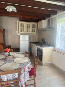 a kitchen with a table with plates on it at Gîte Bellevue in Ossen