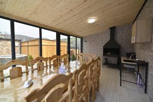 a dining room with a long table and chairs at Avra Resort Tsaghkadzor in Tsaghkadzor