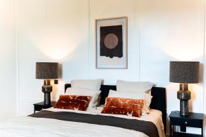 two beds in a bedroom with two lamps at Château de Taulignan in Saint-Marcellin-lès-Vaison +44 photos