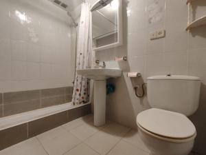 a bathroom with a toilet and a sink at EDIFICIO SOLIMAR 2 HAB en playa Morro de Gos in Oropesa del Mar +16 photos