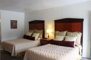 Postel nebo postele na pokoji v ubytování The Way Inn by OYO Spencer