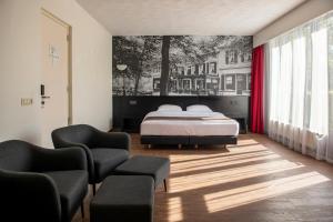 Postel nebo postele na pokoji v ubytování Bastion Hotel Apeldoorn Het Loo