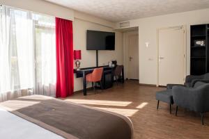 Postel nebo postele na pokoji v ubytování Bastion Hotel Apeldoorn Het Loo